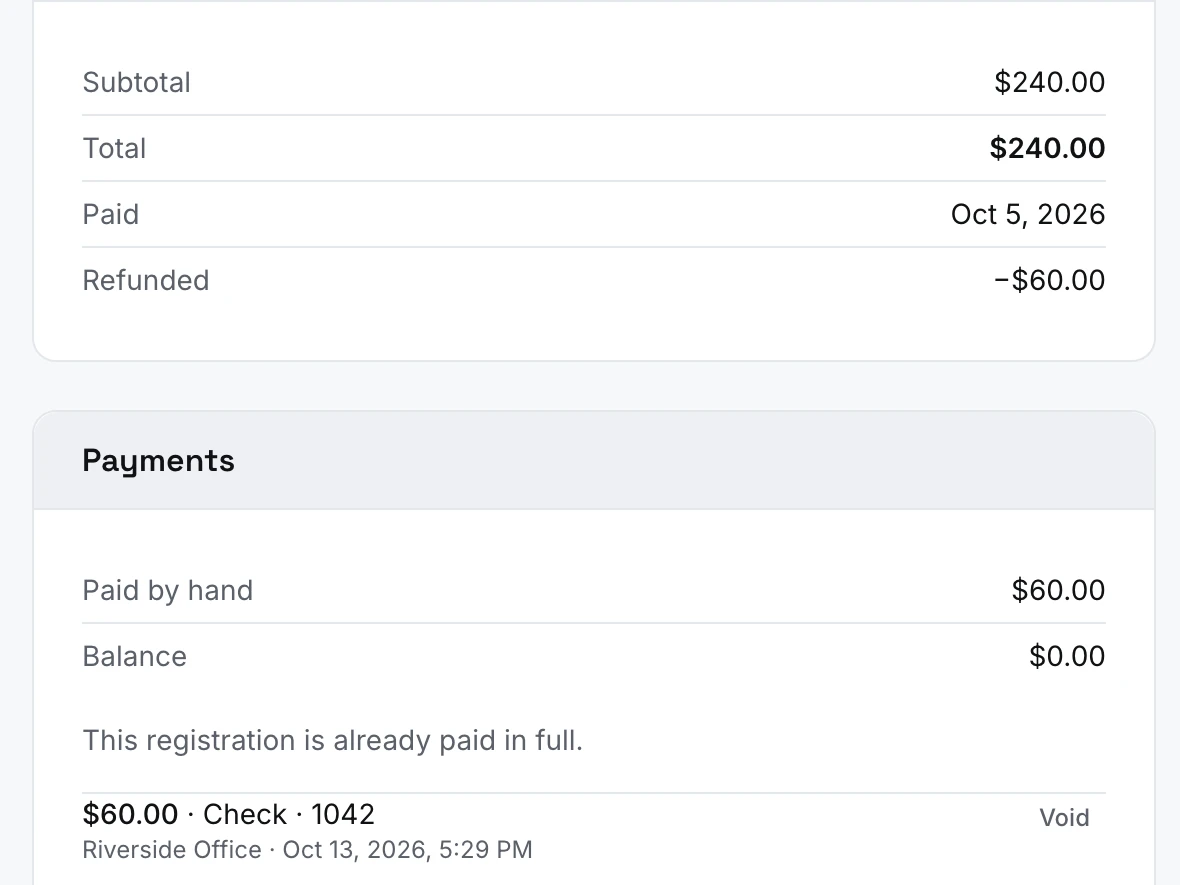 A registration's money: the total, a payment recorded by check, and a partial refund